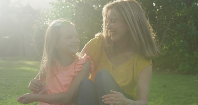 Grandmother and Granddaughter Enjoying Outdoor Time in Sunny Garden - Download Free Stock Images Pikwizard.com