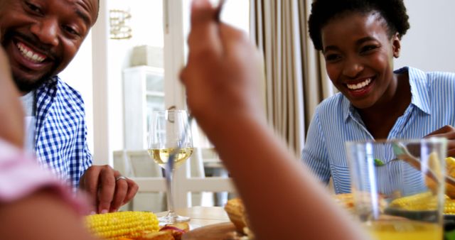 African American Friends Enjoying a Lively Meal Together with Copy Space - Download Free Stock Images Pikwizard.com