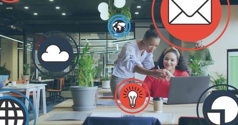 Diverse Coworkers Discussing in Dynamic Office Enviornment