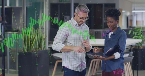 Colleagues Discussing Data with Digital Interface