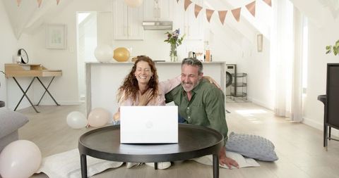 Mature Couple Enjoying Video Chat in Modern Living Room
