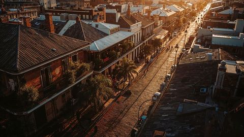 Historic Street with Tram Rails and Palm Trees During Sunset