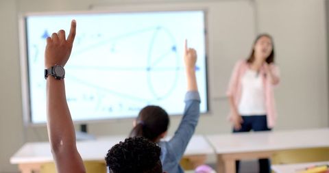 Engaged Students and Teacher in Lively High School Classroom
