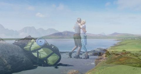 Mature Couple Embracing on Scenic Lakeshore Adventure