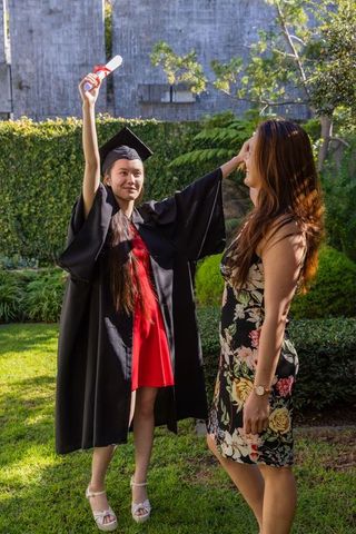 Young Graduate Celebrating with Family in Lush Garden Setting