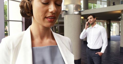 Business professionals contemplating challenges in office environment