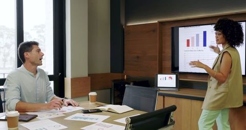 Diverse Professionals Collaborating on Data Analytics in Office Meeting