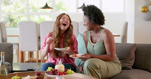 Diverse Couple Joyfully Celebrating at Birthday Party at Home