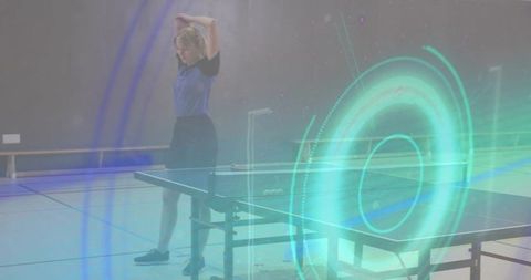 Female athlete gathering hair at table tennis table with futuristic teal holographic ring