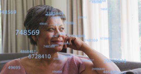 Senior Woman with Digital Number Overlay Representing Technology Concept