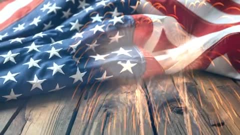 American Flag with Fireworks Overlay on Wooden Surface