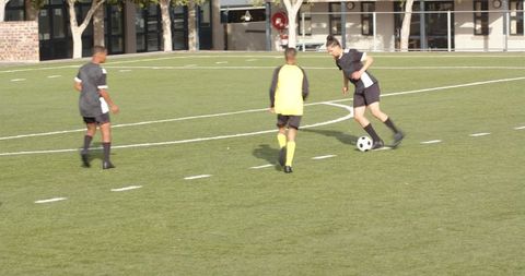 Competitive youth soccer players in action on field