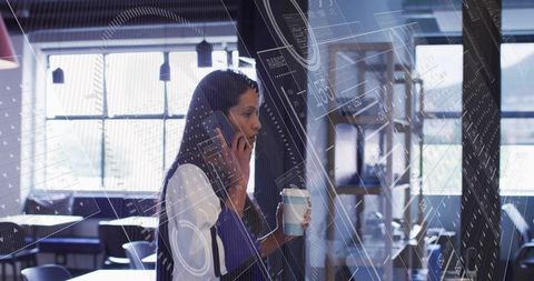 Businesswoman Examines Digital Data Charts in Modern Office