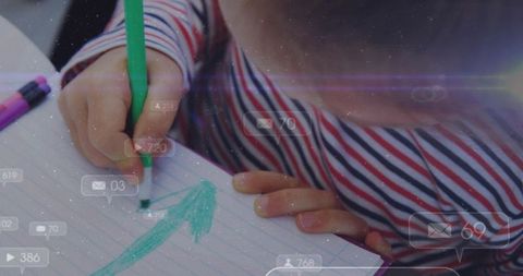 Child Drawing Arrow on Paper with Social Media Overlays