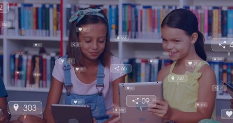 Girls using tablets in library with social UI overlays, reading and sharing learning
