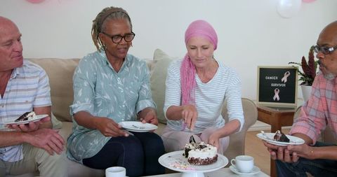 Senior Friends Enjoying Cake in Intimate Gathering