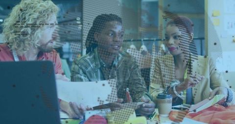 Collaborating team reviewing designs in modern studio