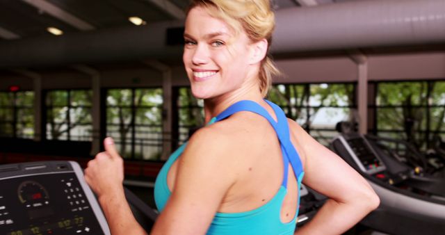 Smiling Woman Running on Treadmill in Modern Gym - Download Free Stock Images Pikwizard.com