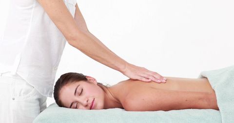 Young Woman Enjoying Relaxing Massage Therapy Session - Download Free Stock Images Pikwizard.com