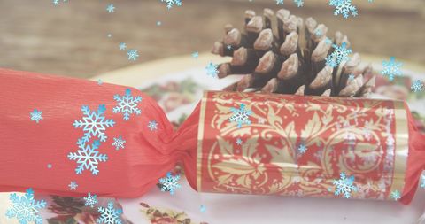 Festive Holiday Cracker Red Wrap and Pine Cone Snowflakes