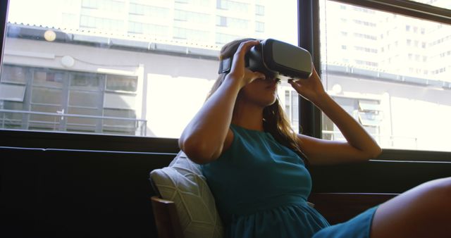 Woman using VR headset in modern living room - Download Free Stock Images Pikwizard.com