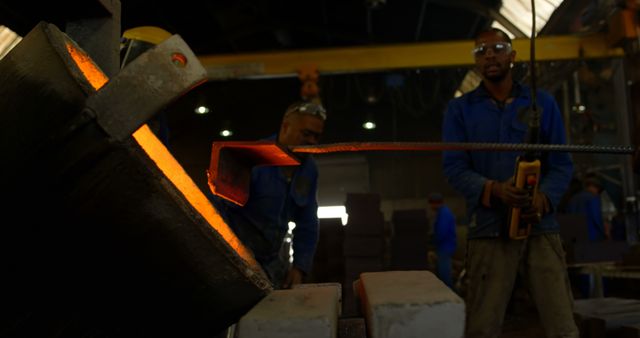 Workers Engaged in Process of Steel Forging in Industrial Workshop - Download Free Stock Images Pikwizard.com