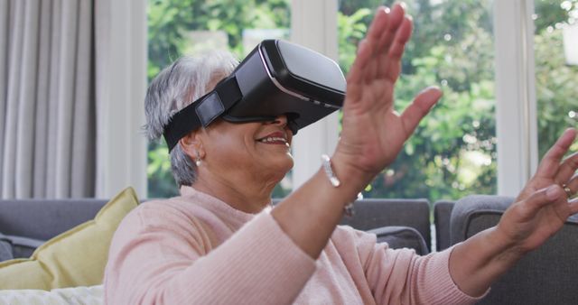 Senior Woman Enjoying Virtual Reality at Home in Living Room - Download Free Stock Images Pikwizard.com