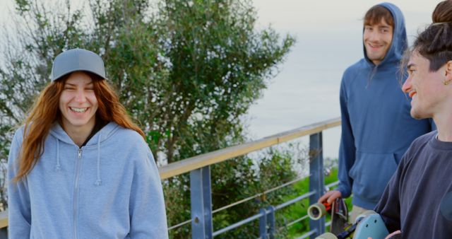 Young Friends Laughing Outdoors by Ocean View - Download Free Stock Images Pikwizard.com