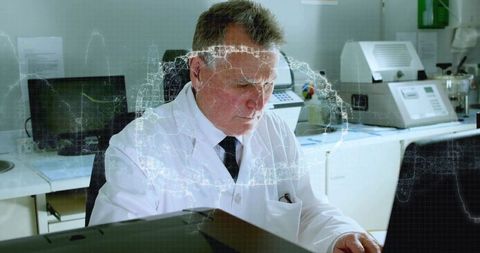 Senior scientist analyzing diagnostic data with holographic overlay in medical laboratory