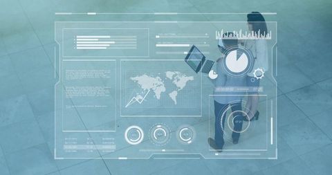 Business team walking atrium with laptop viewing futuristic HUD analytics overlay