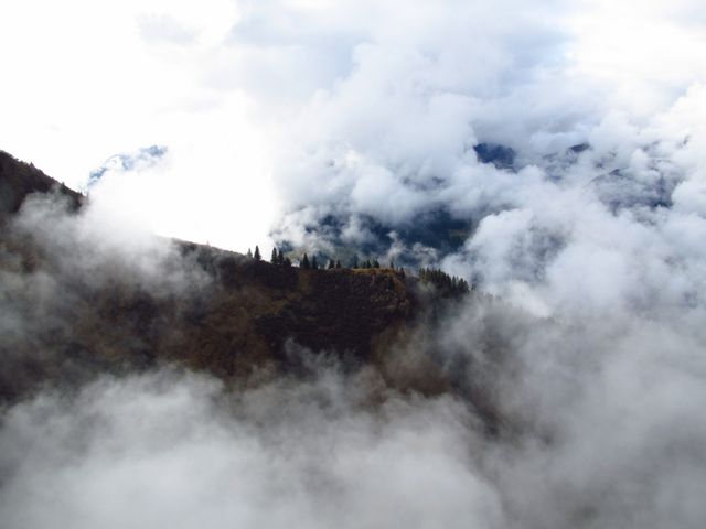 Misty Mountain Landscape with Dense Cloud Cover - Download Free Stock Photos Pikwizard.com
