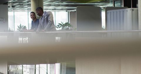 Professionals Engaging in Modern Office Collaboration