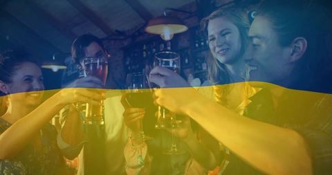 Friends Celebrating with Drinks Amidst Festive Ambiance