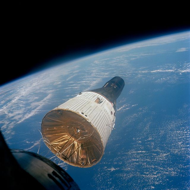 S65-63220 (15 Dec. 1965) --- This photograph of the Gemini-Titan 7 (GT-7) spacecraft was taken from the Gemini-Titan 6 (GT-6) spacecraft during the historic rendezvous of the two spacecraft on Dec. 15, 1965. The two spacecraft are some 37 feet apart here. Earth can be seen below. Astronauts Walter M. Schirra Jr., command pilot; and Thomas P. Stafford, pilot, were inside the GT-6 spacecraft, while crewmen for the GT-7 mission were astronauts Frank Borman, command pilot, and James A. Lovell Jr., pilot. Photo credit: NASA or National Aeronautics and Space Administration