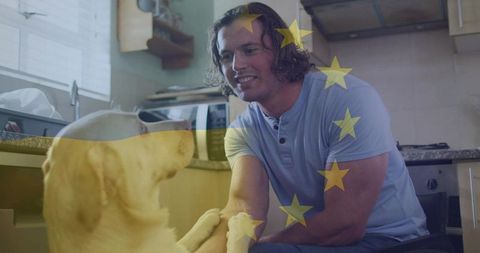 Man Playing with Dog in Kitchen with European Union Flag Overlay