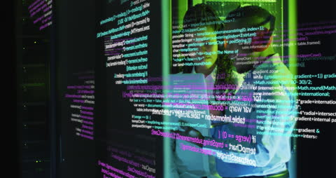 Engineers Monitoring Data on Servers in High-Tech Room