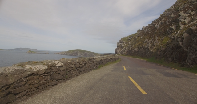 Transparent Coastal Country Road by Cliffside Overlooking Calm Sea - Download Free Stock Videos Pikwizard.com