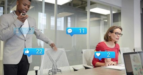 Business Professionals Engaging with Digital Media in Modern Office