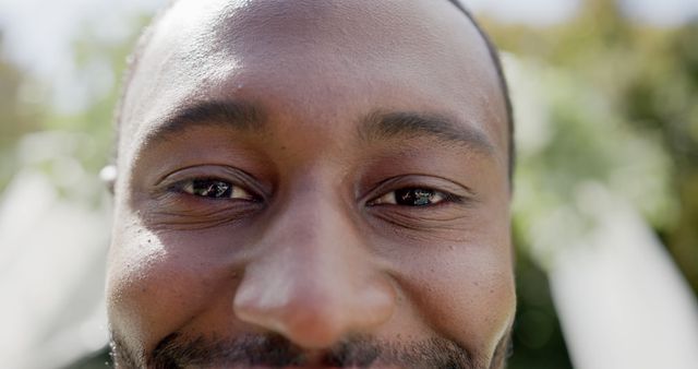 Close-up of cheerful man outdoors with bright sunlight - Download Free Stock Images Pikwizard.com