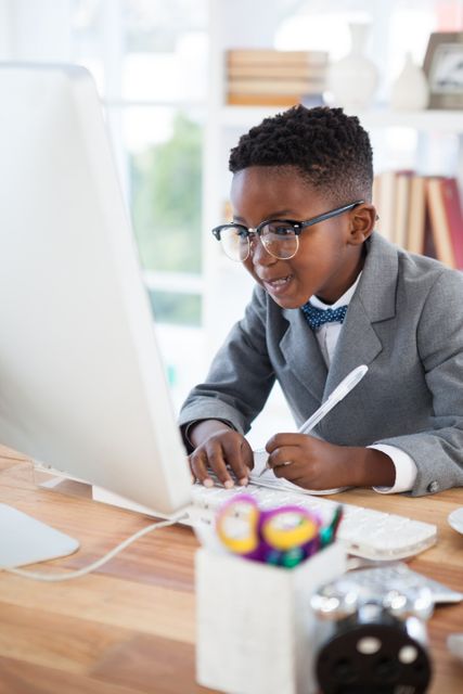 Young Businessman Writing Report on Computer in Office - Download Free Stock Photos Pikwizard.com