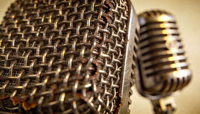 Worn Microphone Grille Macro Showing Rust and Patina with Vintage Chrome Mic