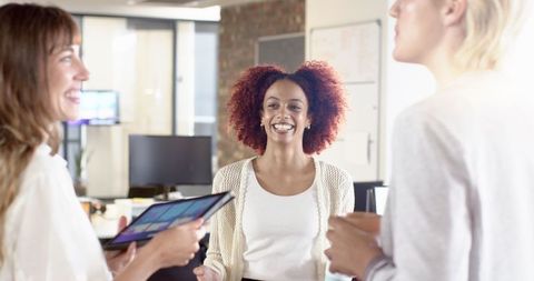 Diverse Team of Women Collaborating in Modern Office Space