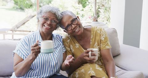Senior African American Women Enjoying Friendship with Coffee