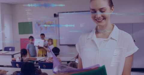 Female teacher smiling while reviewing student work in vibrant classroom with tech overlay