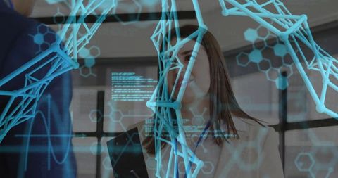 Professionals collaborating with 3d molecular model in modern office