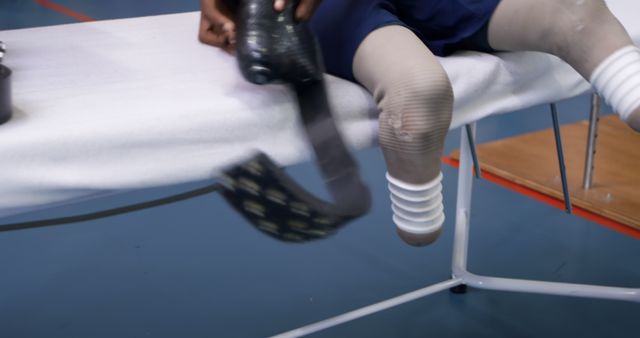 Athlete Attaching Prosthetic Leg in Sports Facility - Download Free Stock Images Pikwizard.com