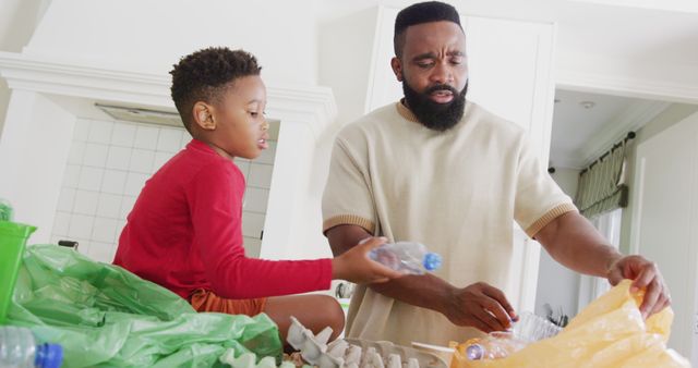 Father and son engaging in an environmental activity by sorting plastic bottles for recycling. Teaches the importance of eco-friendly practices and sustainable living. Perfect for content related to family bonding, environmental conservation, and sustainability initiatives.