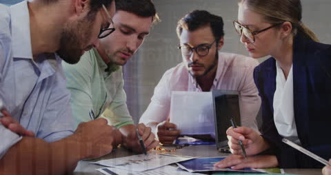 Diverse Team Discussing Financial Data in Modern Workspace