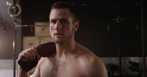 Caucasian Athlete Resting After Intense Gym Workout