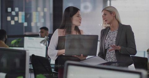 Professionals collaborating in modern open-plan office environment